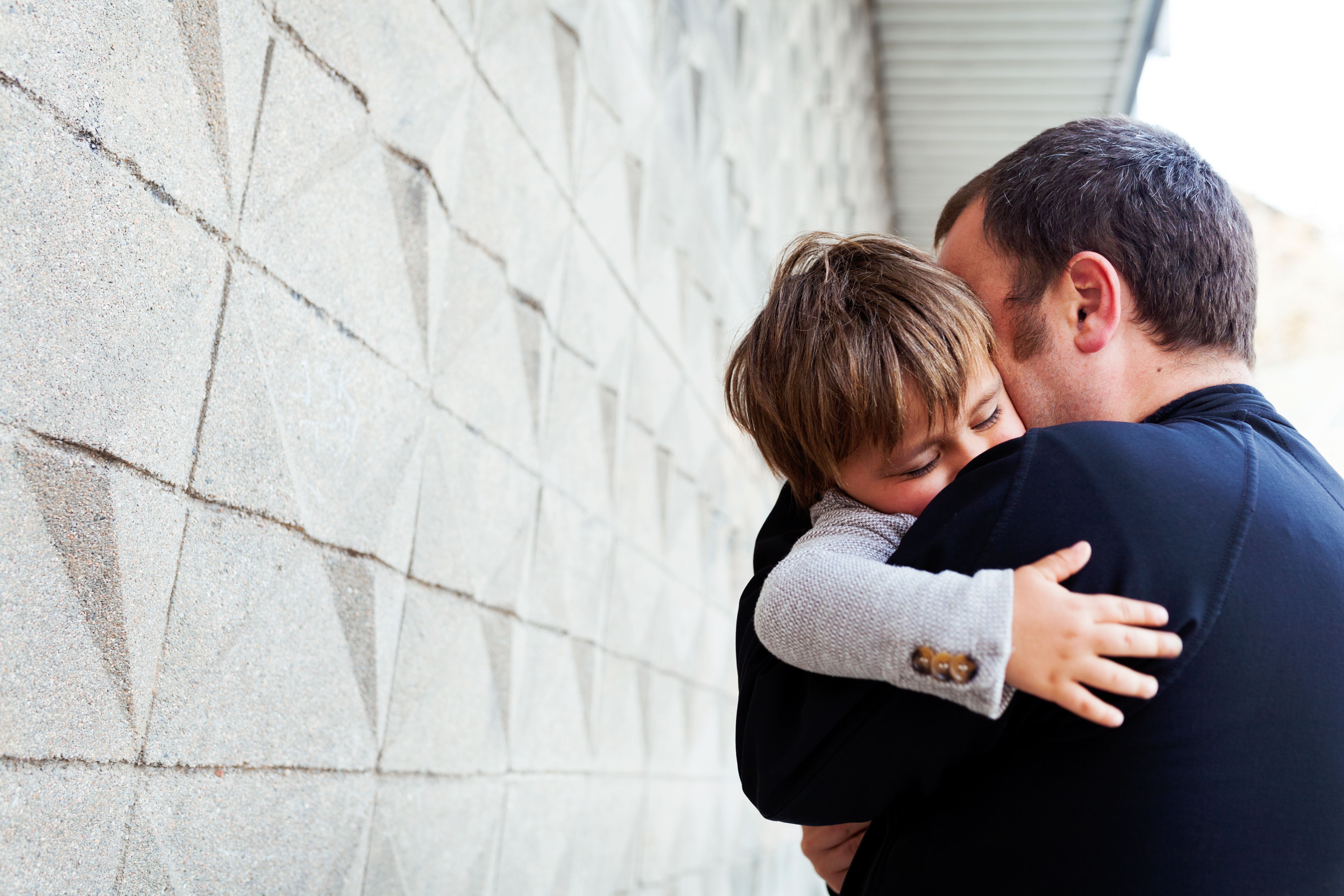 Father Hugging Son